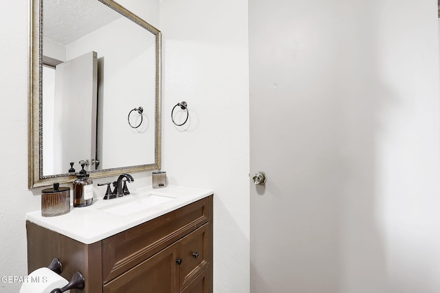 bathroom featuring vanity and a textured ceiling