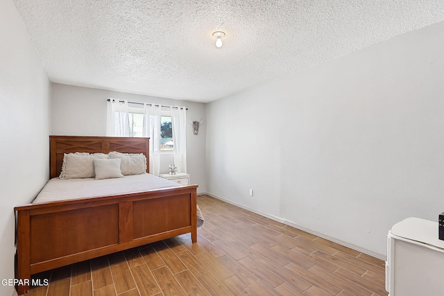 bedroom with a textured ceiling