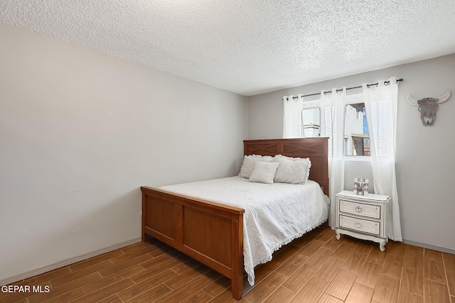 bedroom featuring a textured ceiling