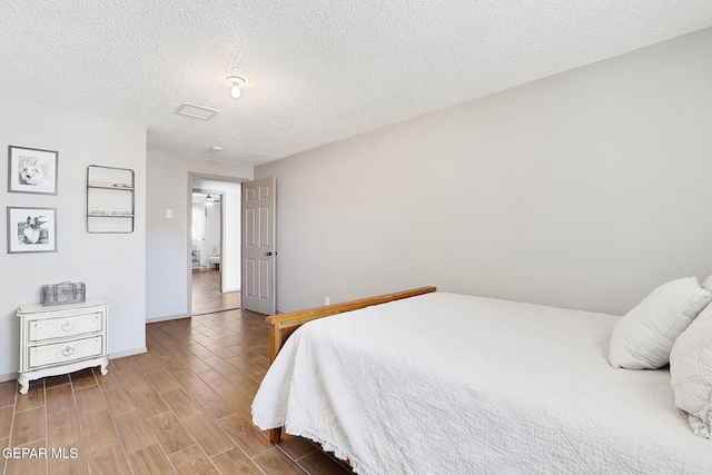 bedroom featuring a textured ceiling