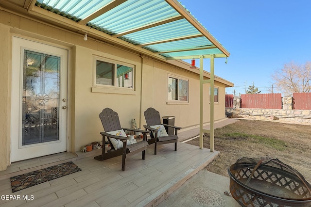 view of patio with a fire pit