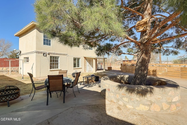 view of patio / terrace featuring an outdoor fire pit