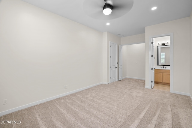 unfurnished bedroom with baseboards, recessed lighting, and light colored carpet