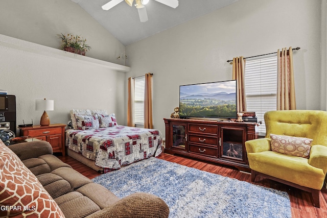 bedroom with hardwood / wood-style flooring, vaulted ceiling, and ceiling fan