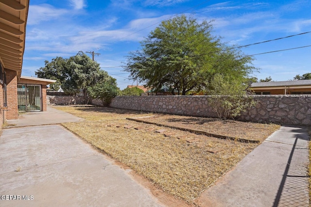 view of yard featuring a patio and fence private yard