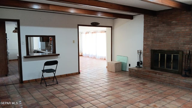 8808 Cosmos Ave, El Paso, TX 79925 - unfurnished living room with beamed ceiling, a fireplace, and baseboards