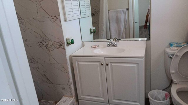 8808 Cosmos Ave, El Paso, TX 79925 - bathroom with toilet and vanity