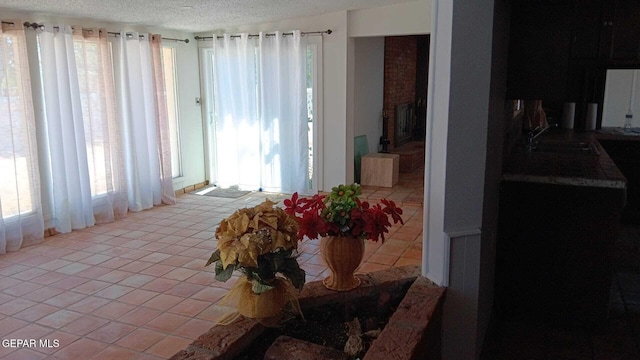 8808 Cosmos Ave, El Paso, TX 79925 - dining space featuring light tile patterned floors and a textured ceiling