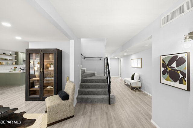 stairs featuring hardwood / wood-style flooring