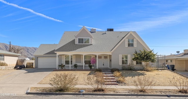 view of front of home with a garage and covered porch