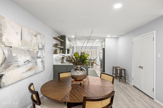 dining area with light hardwood / wood-style flooring