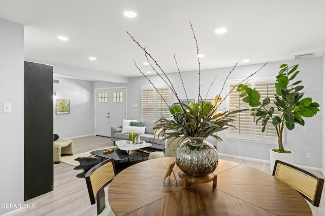 dining space with light wood-type flooring