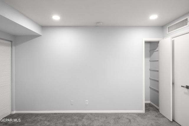 unfurnished bedroom with carpet floors and a closet