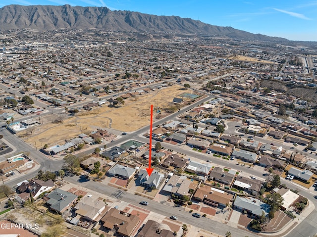 birds eye view of property with a mountain view