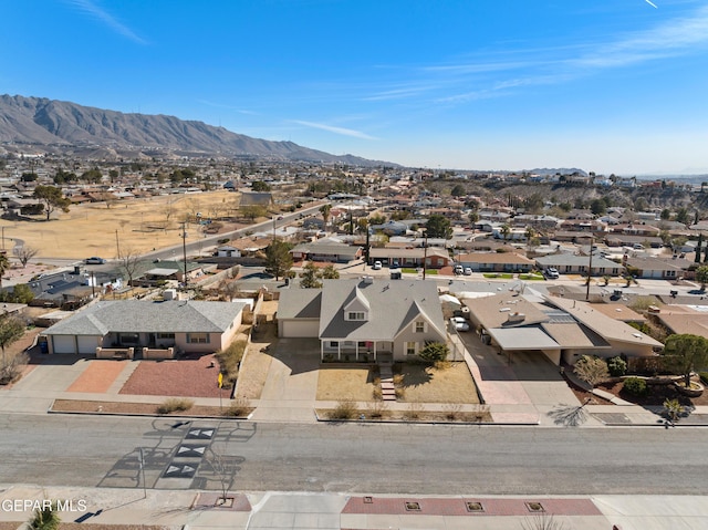 birds eye view of property featuring a mountain view