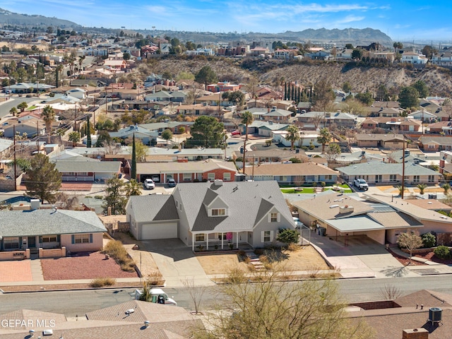 drone / aerial view featuring a mountain view