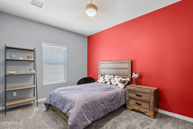 bedroom with ceiling fan and carpet floors