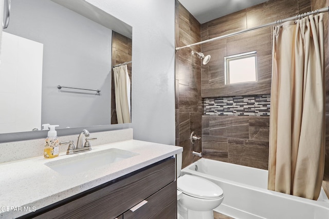 full bathroom featuring vanity, shower / tub combo, and toilet