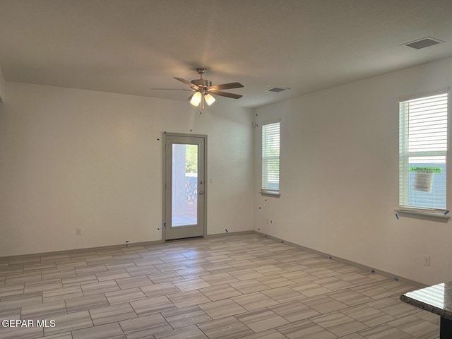 empty room featuring ceiling fan