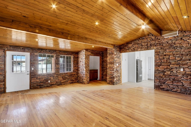 unfurnished living room with vaulted ceiling with beams, wooden ceiling, and light wood-type flooring