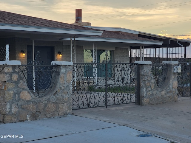 view of gate at dusk