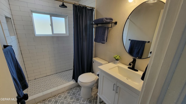 bathroom featuring walk in shower, tile patterned floors, vanity, and toilet