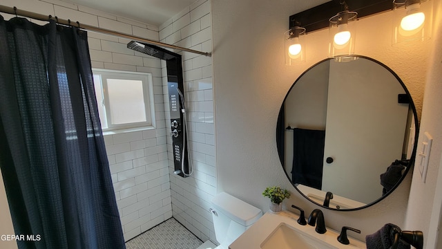 bathroom featuring sink and curtained shower