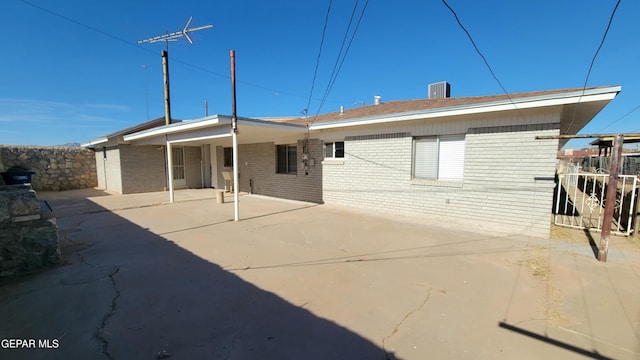 back of property with a patio