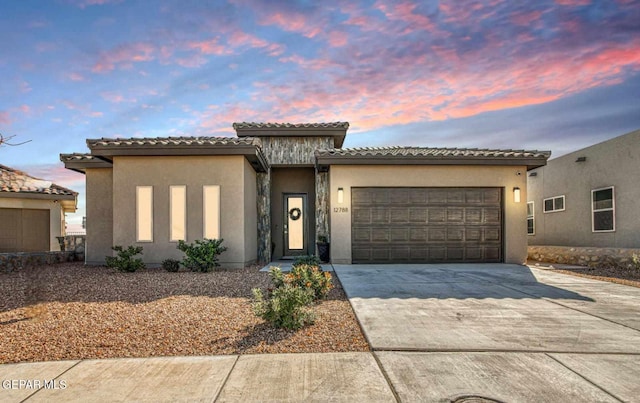 view of front of property with a garage