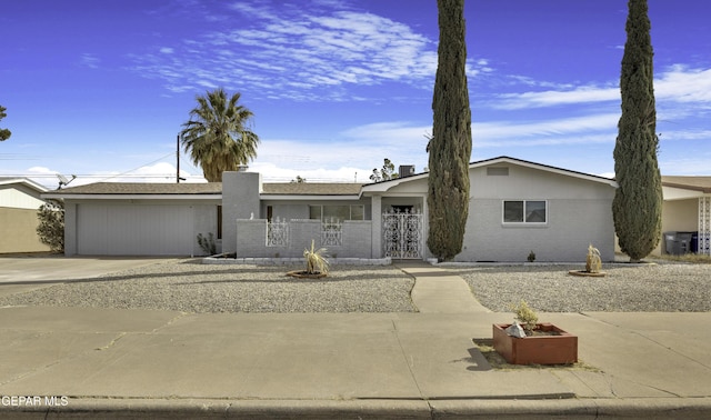 ranch-style house featuring a garage