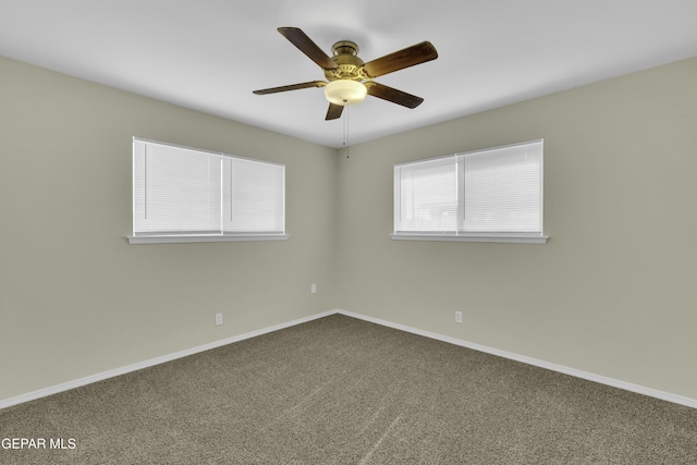 carpeted empty room featuring ceiling fan