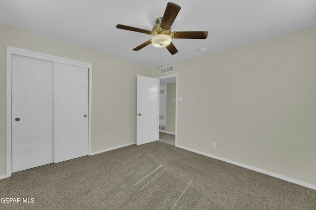 unfurnished bedroom with carpet floors, a closet, and ceiling fan