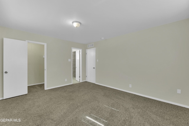 unfurnished bedroom featuring a closet and carpet flooring