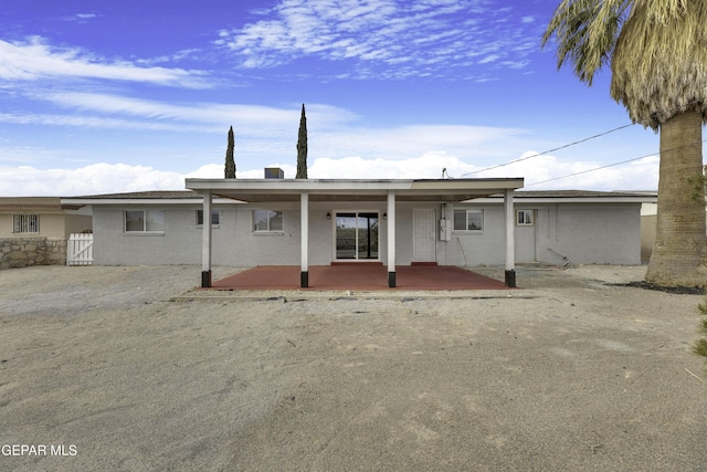 back of property featuring a patio area