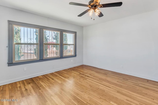 unfurnished room featuring ceiling fan and light wood-type flooring