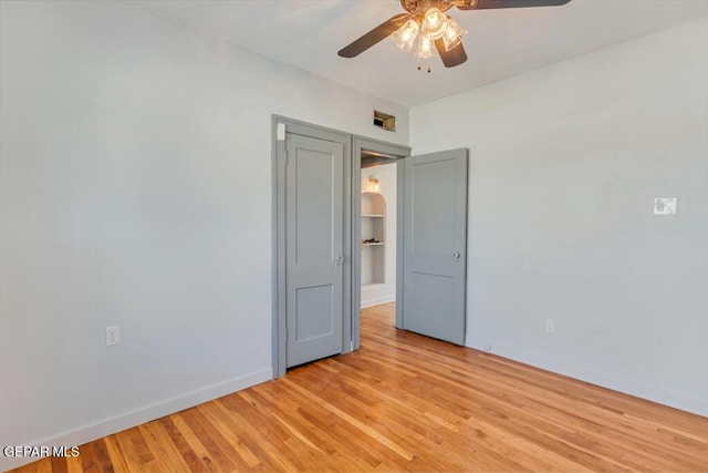 unfurnished room with ceiling fan and light hardwood / wood-style floors