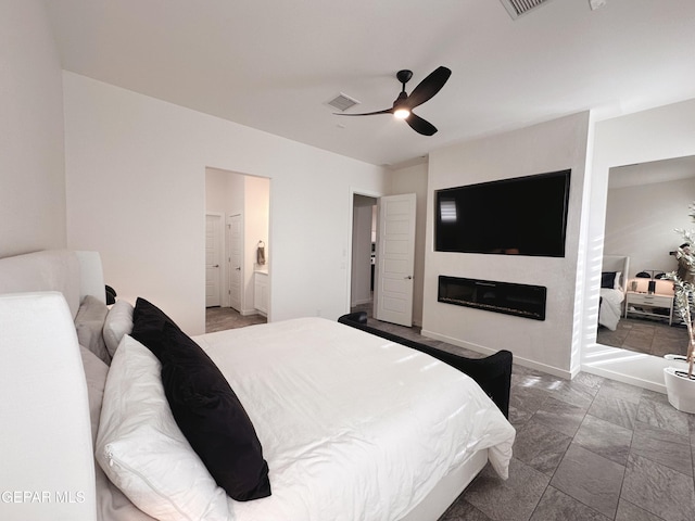 bedroom with connected bathroom and ceiling fan