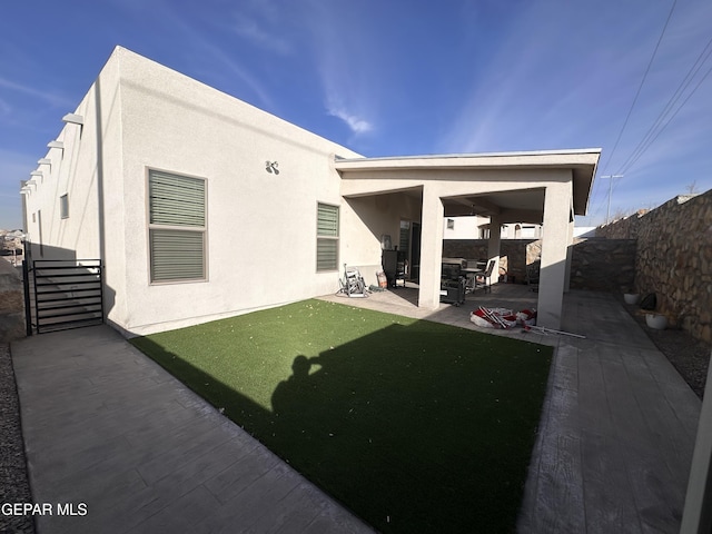 back of house with a patio area