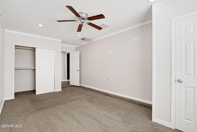 unfurnished bedroom featuring crown molding, dark carpet, ceiling fan, and a closet