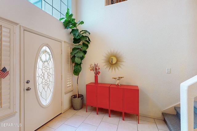 foyer featuring light tile patterned floors