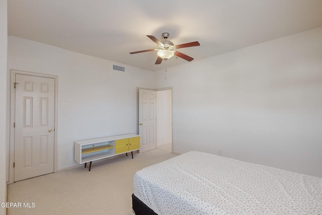 bedroom featuring light carpet and ceiling fan