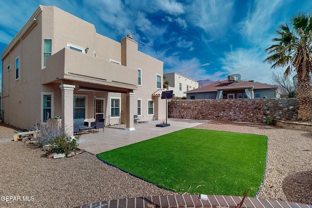 rear view of property with a patio