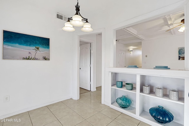 interior space with tile patterned flooring and ceiling fan