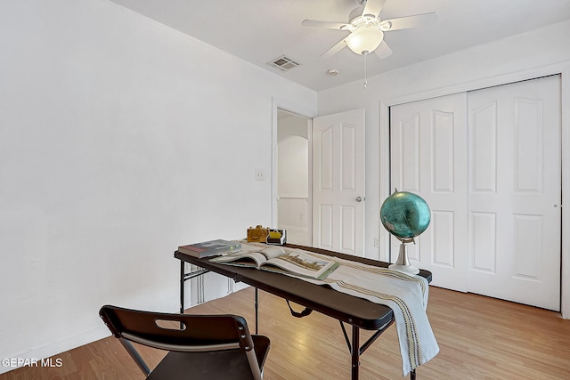 office featuring ceiling fan and light hardwood / wood-style floors