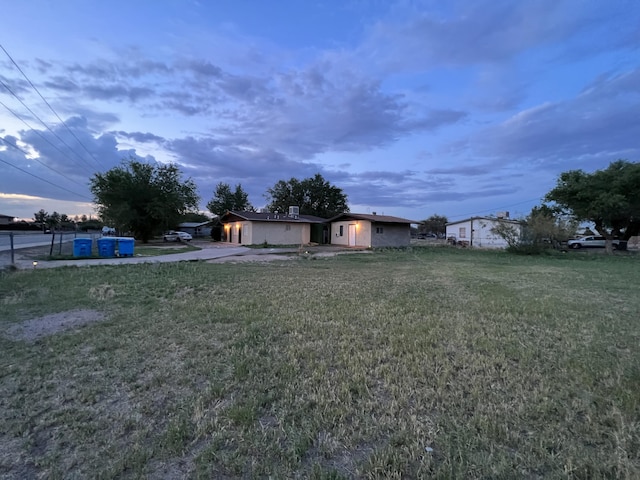 view of yard at dusk