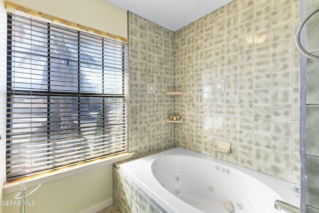 bathroom with tiled bath