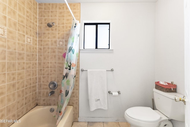 bathroom featuring shower / bath combination with curtain, tile patterned floors, and toilet