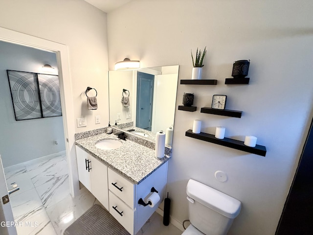 bathroom with vanity and toilet