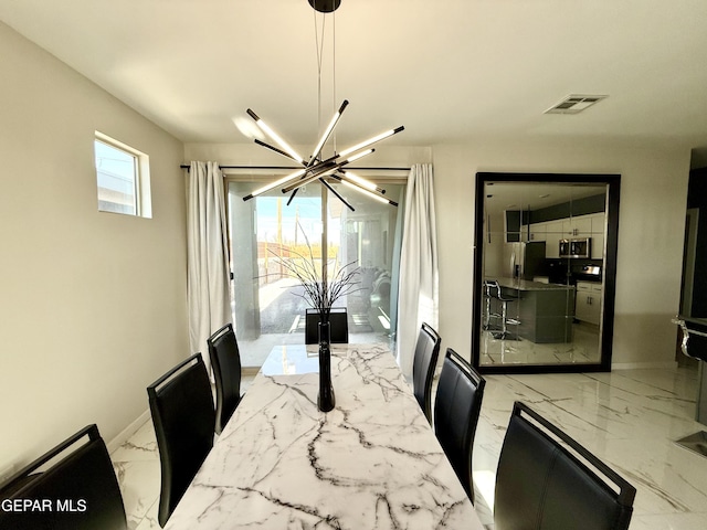 dining room with a chandelier