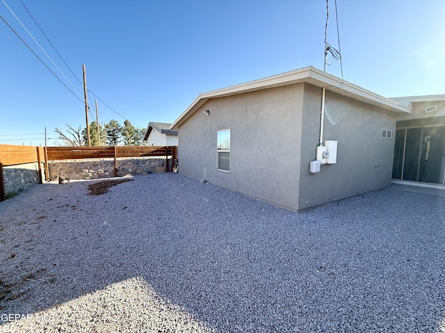 view of side of property featuring a patio area